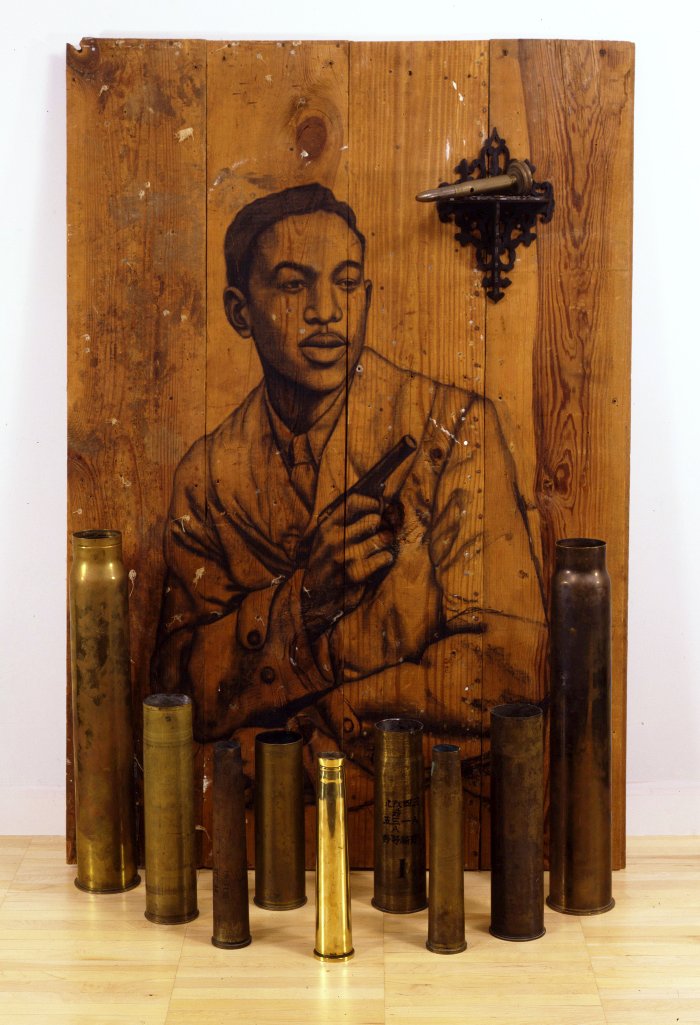 You're My Thrill, 2004 - Charcoal on wood, bombshell casings. 54 x 36 1/2 x 14 in. ©Whitfield Lovell. Courtesy DC Moore Gallery, New York, and American Federation of Arts