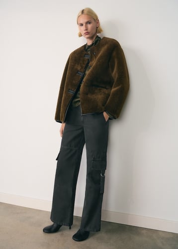 Fur-effect coat with appliqués