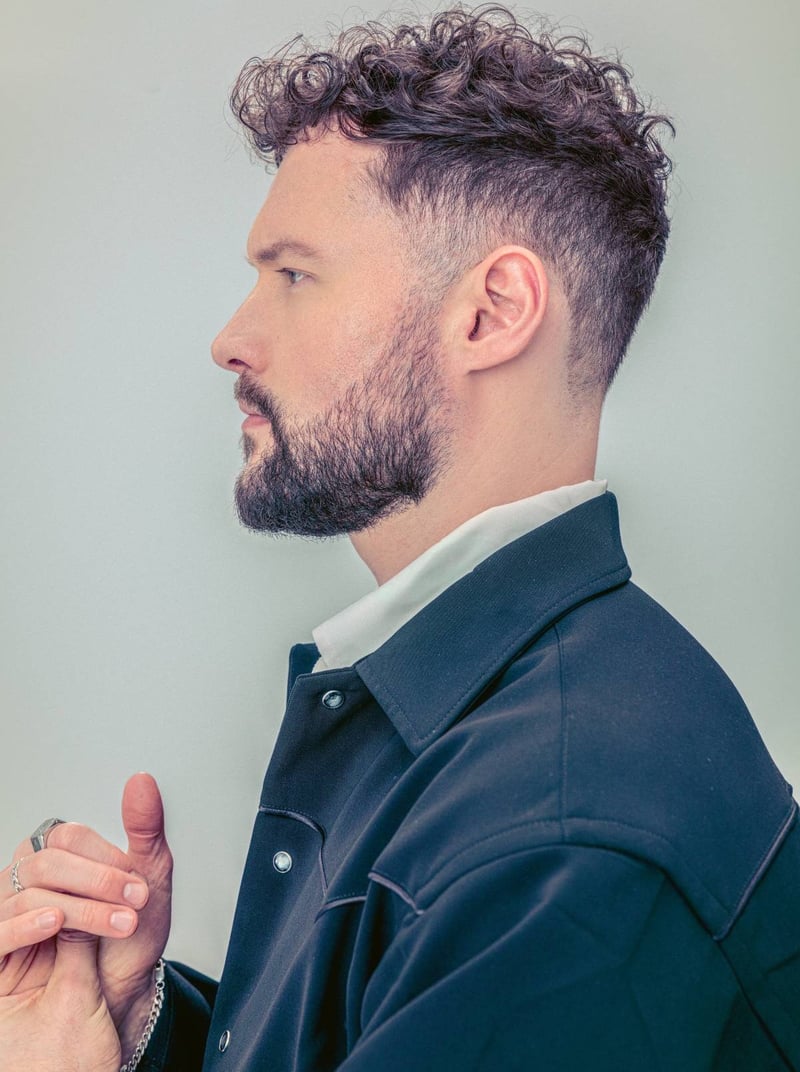 Calum Scott and Christina Perri duet on their heartwarming holiday hit “Kid at Christmas”