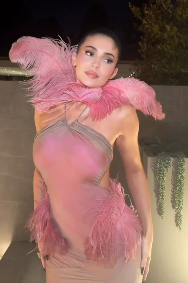 Kylie Jenner Turns Heads in Pink Feather Holiday Dress at Kylie Cosmetics Party