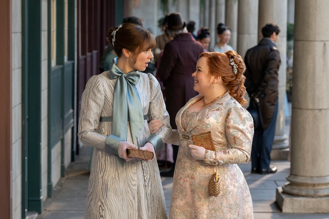 Claudia Jessie as Eloise Bridgerton and Nicola Coughlan as Penelope Featherington in Bridgerton Season 4.