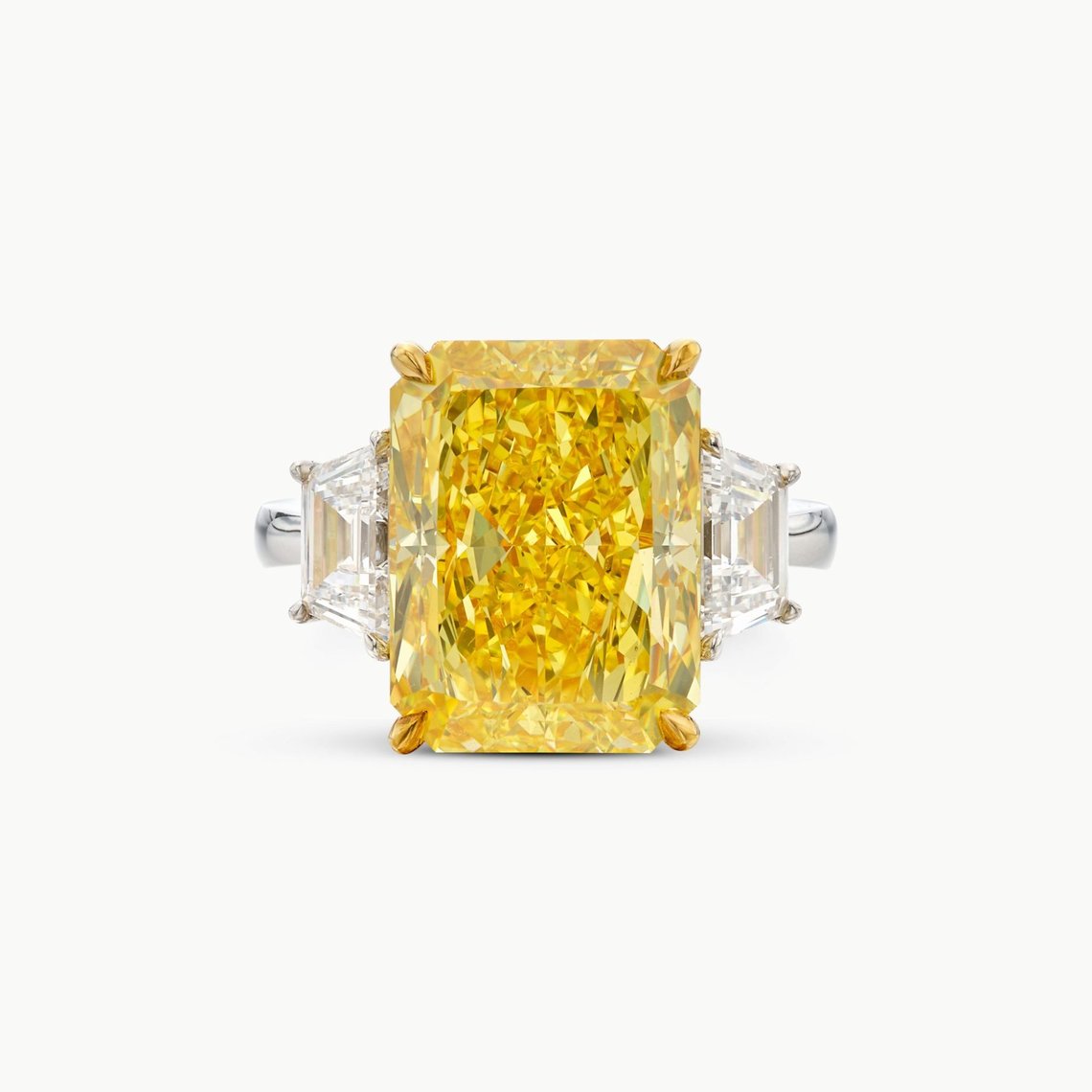 Lot 604. Fancy Vivid Yellow Diamond and Diamond Ring, est. 320,000 - 480,000 CHF