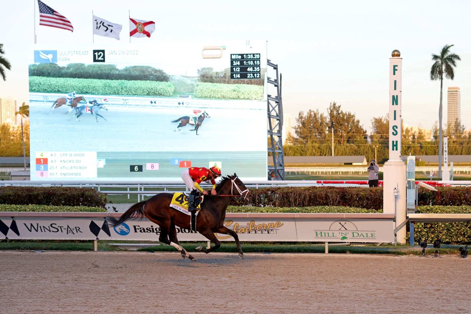 Life is Good and Irad Ortiz Jr. crossing the finish line at the 2022 Pegasus World Cup at Gulfstream Park - Photo Credit Alexander Tamargo Getty Images